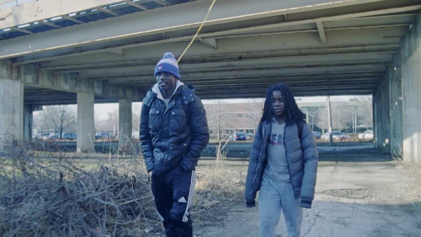Man and woman walk together on a cold day