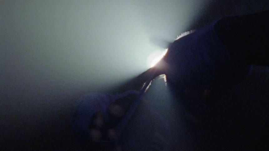 A person is wrapping their hands with tape