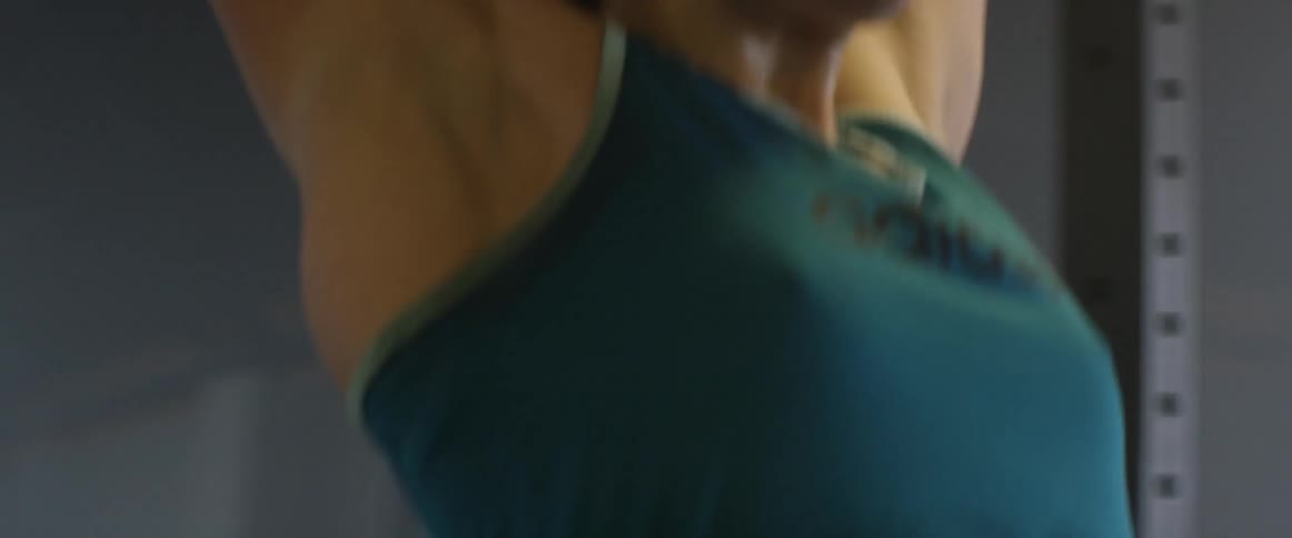A woman doing chin ups