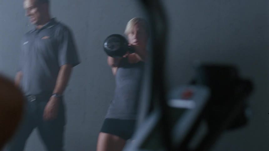 People having a fast paced workout in a gym