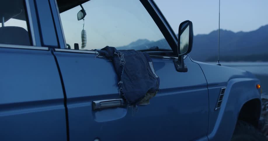 A rag is hanging out of the vehicle window