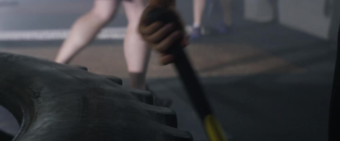 A person walking around a tire
