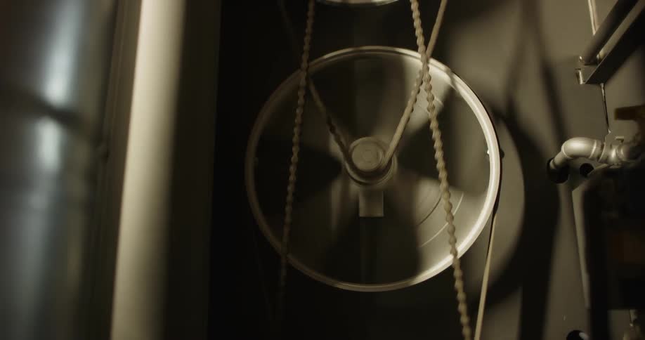 A wheel is spinning with a chain on it