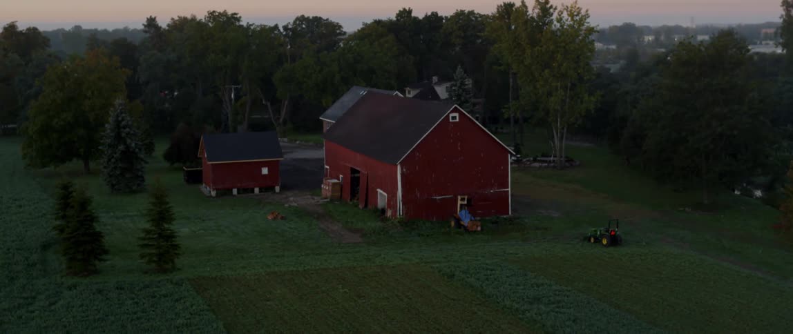 Aerial view of a red barn in the country
