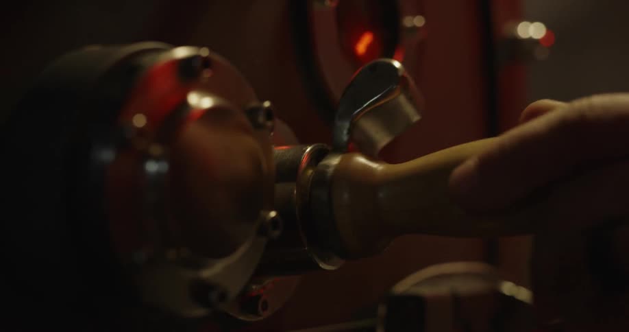 A man services an old coffee machine