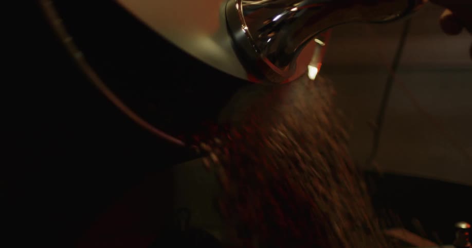 Coffee beans are coming out of a machine