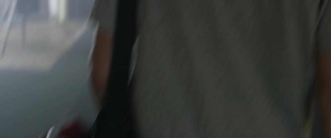 A person carrying their shoes