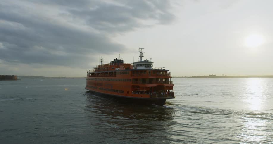 A large ship is slowly cruising through the water