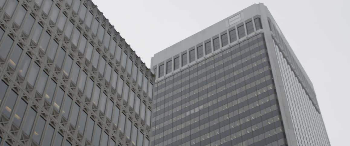 A tall building is lined with windows