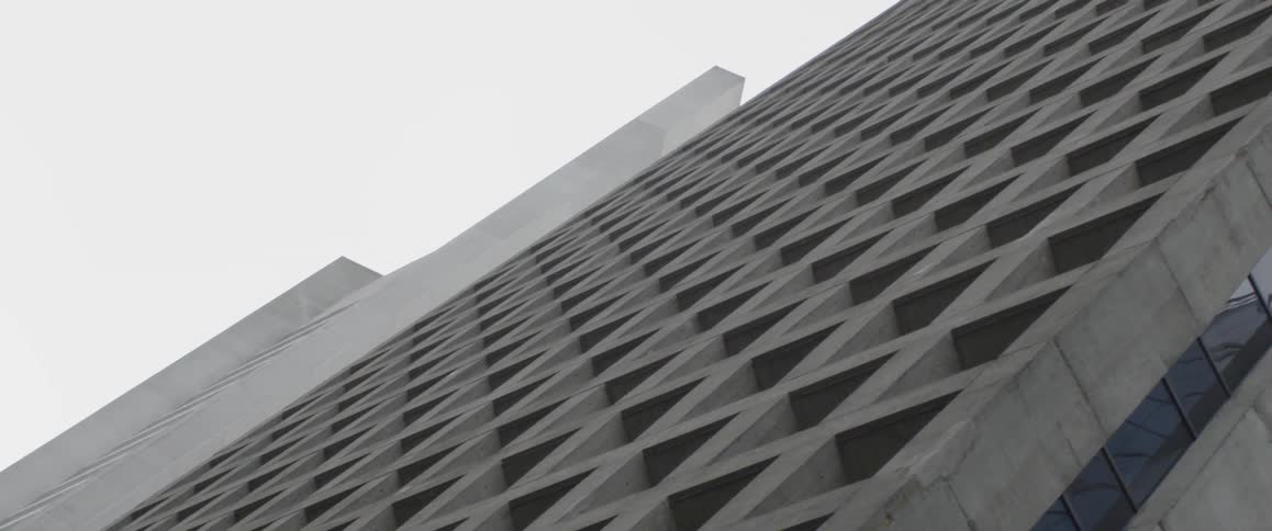 A concrete building stands in a city