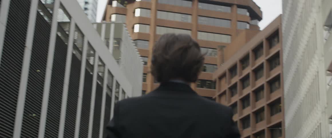 Man Walking Around City