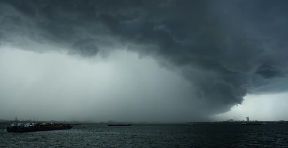 Storm clouds form over a body of water