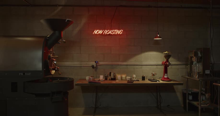 A sign glows at a coffee roasting company