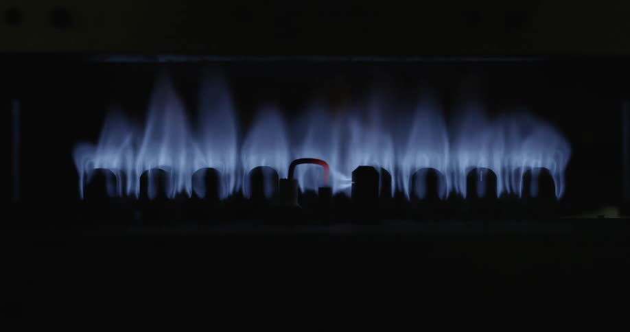 A propane flame is getting larger across