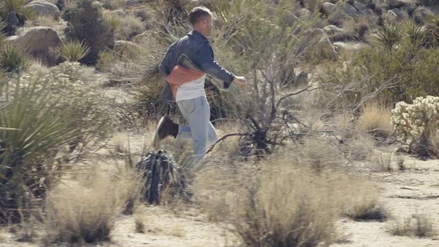 Man is running through the desert