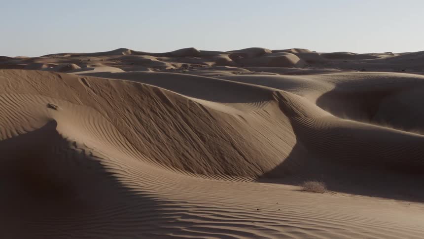 Sandy hills cover a desert landscape