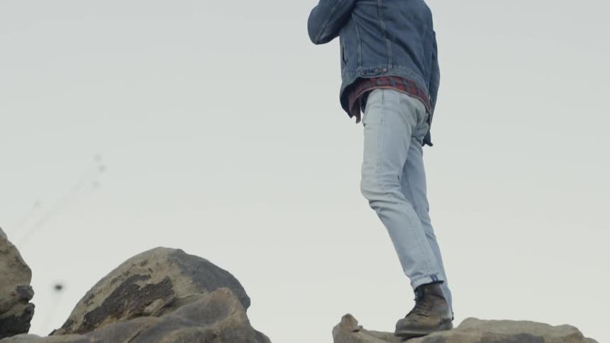 Man standing on large boulders