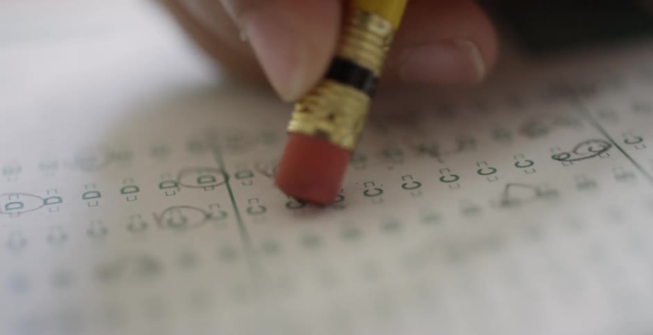 An eraser on the end of a pencil erases an answer that had been selected