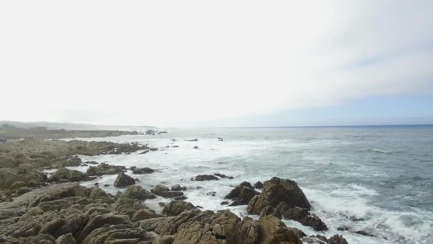 The waves are rolling into the shore