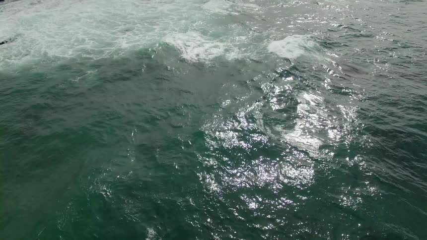 A scenery of a blue ocean at cloudy day