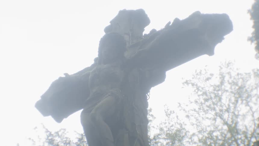 Statue of a crucifix in a cemetery