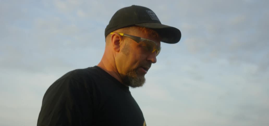 A man is walking on the field talking