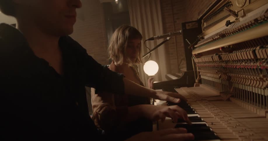 People Playing Music In Studio