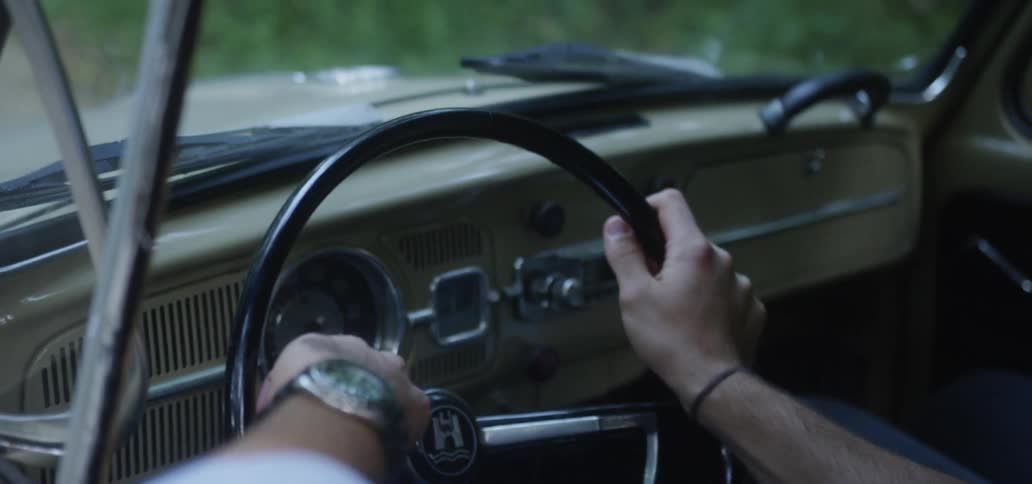 Young Couple Driving Vintage Car