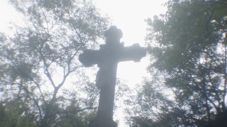 Statue of a crucifix in a cemetery
