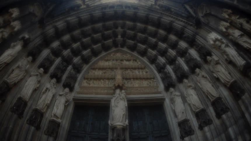 Church wall and archway with very detailed statues and designs