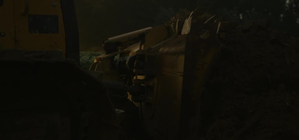 A tractor is moving in a field