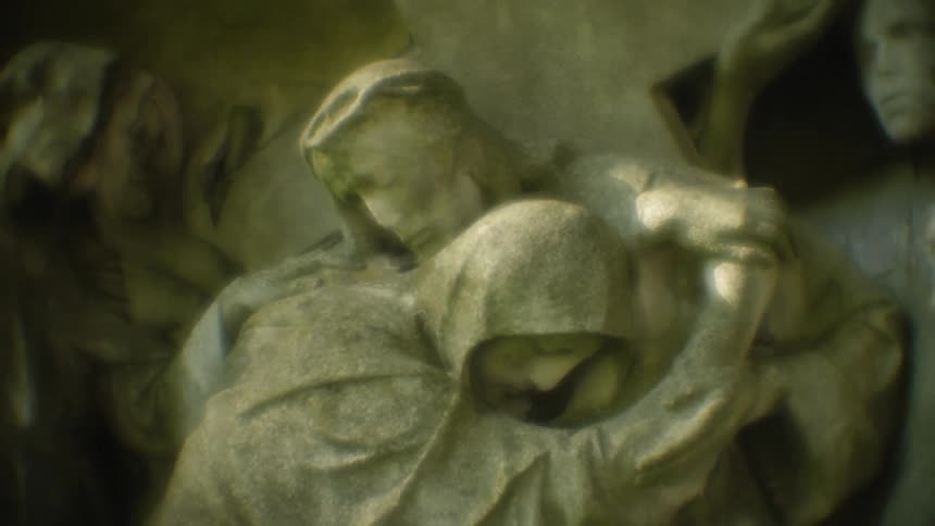 Statue of people holding each other