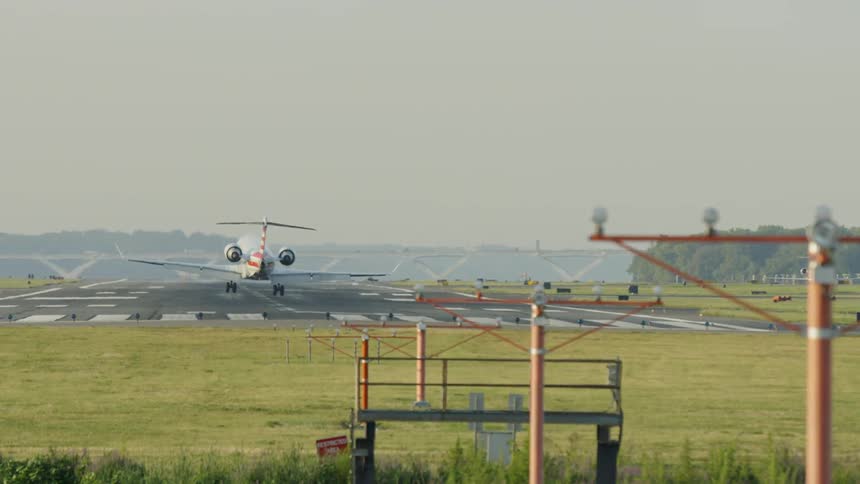 An airplane is landing outdoors