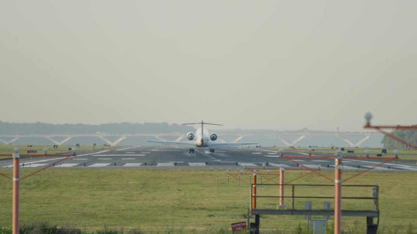 An airplane is landing outdoors