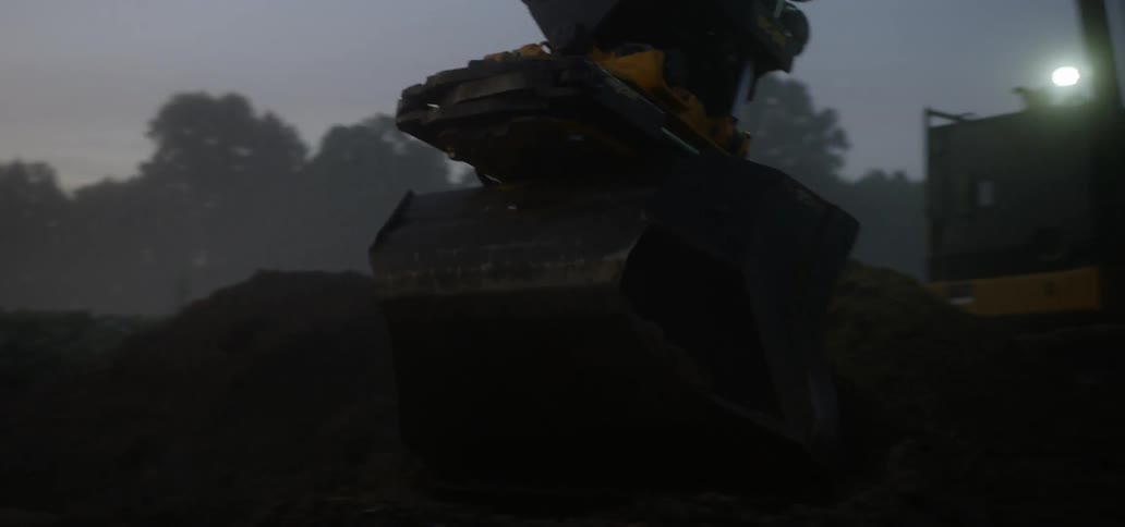 Closeup of earth moving and scooping in progress