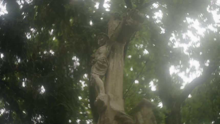 View of statue of jesus on cross from below it