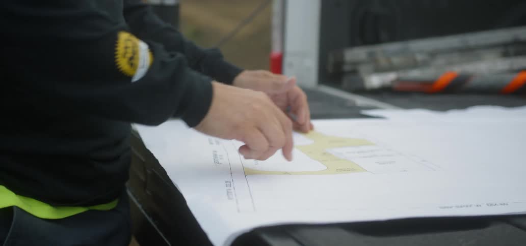 A man looking at a plan