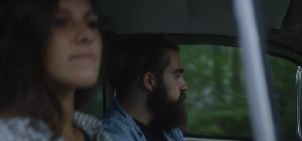 Young Couple Driving Vintage Car