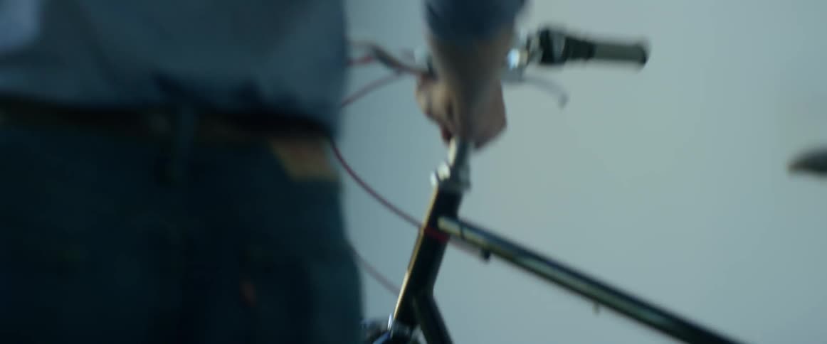 A person is getting his bike