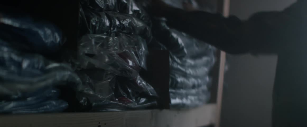 Person putting a package back on a shelf