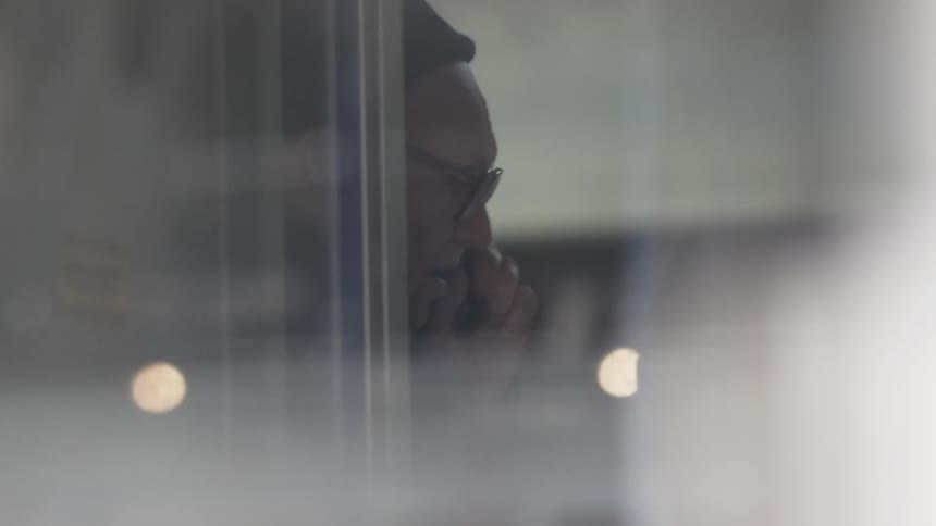 A man is talking on the phone