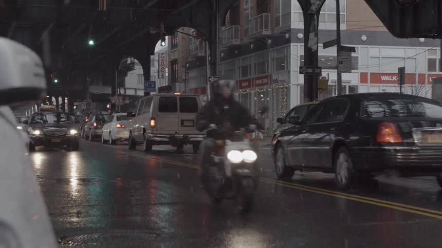 View of a busy city street on a rainy night