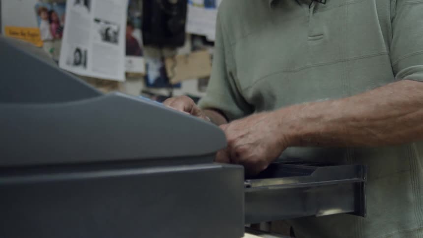 A person using a cash register