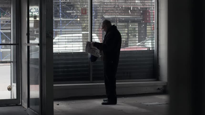 A man standing in a city shop