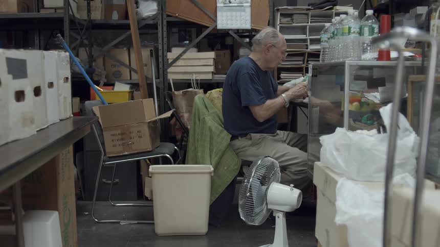 A man is working in a warehouse