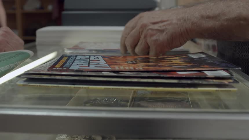 A man viewing some poster