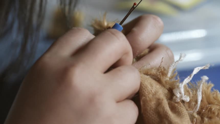 A woman is knitting