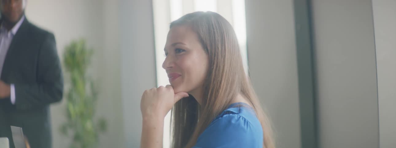 A woman sitting in an office and talking