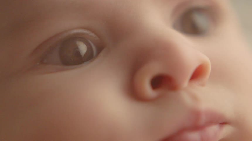A baby stares straight ahead