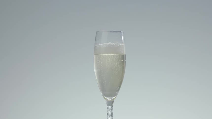 A flute of champagne sitting still